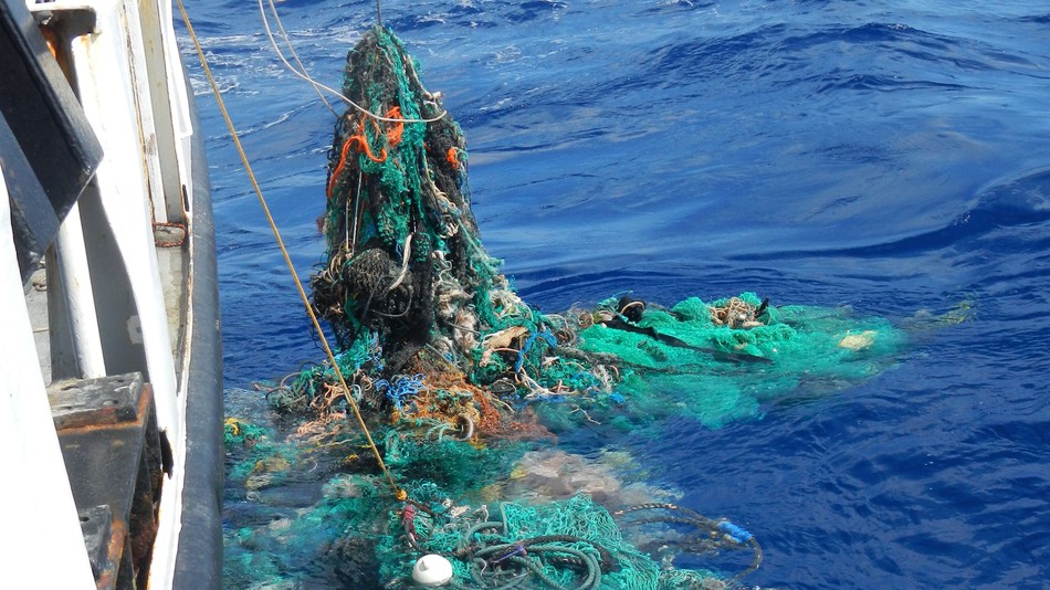 Ghost fishing net catching and pulling onboard